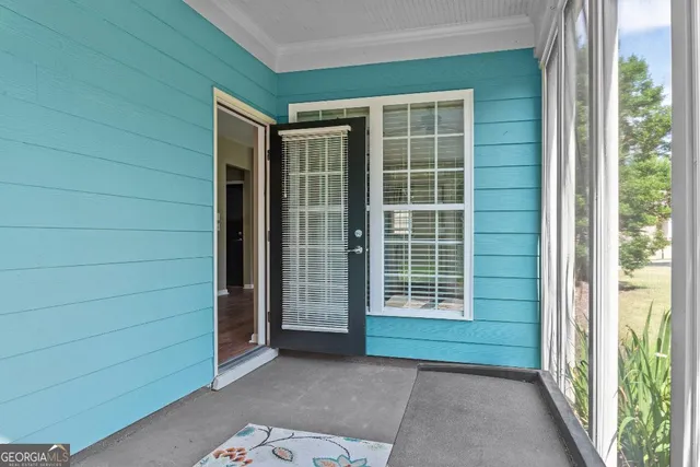 an aerial view of residential building and lake
