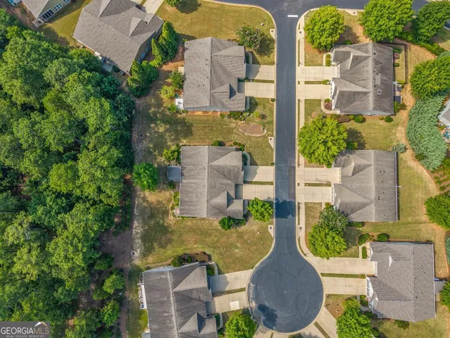 a view of swimming pool with lawn chairs