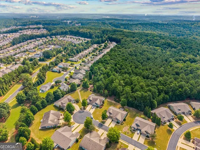 a street sign that is sitting on a brick wall