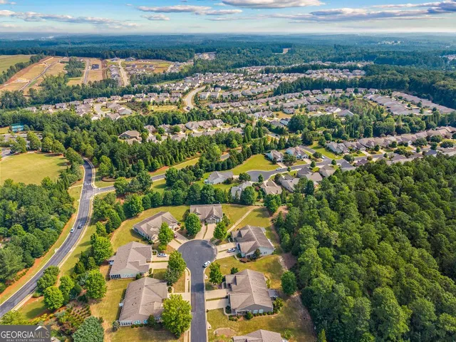 a view of patio with a table and chairs