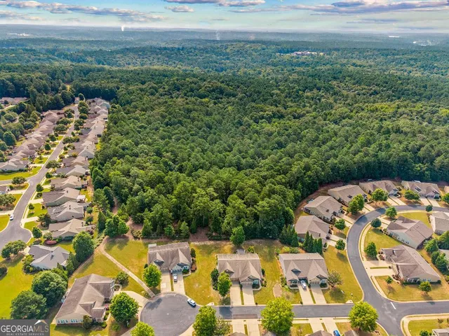 a room with furniture and large windows