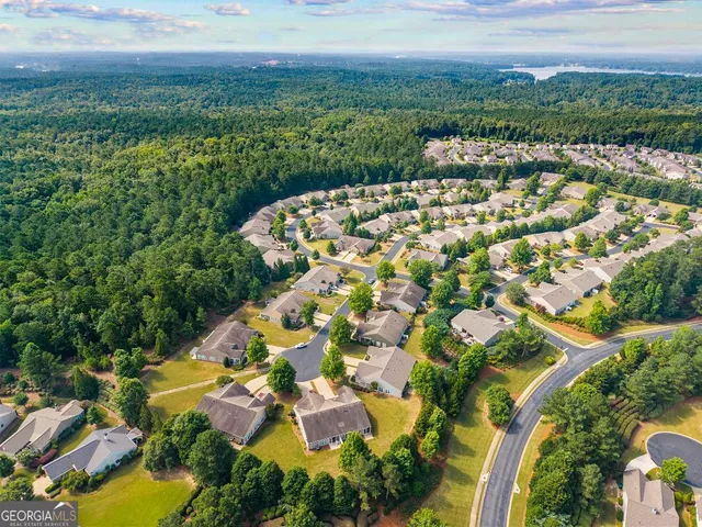 a view of a dining room with furniture and a large window