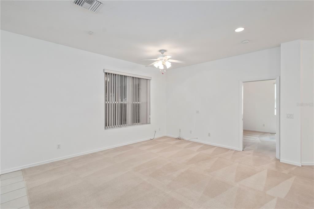 9441 Southwest 90th Street Ocala, FL 34481 - Photo 13 of 48 a view of an empty room with a window
