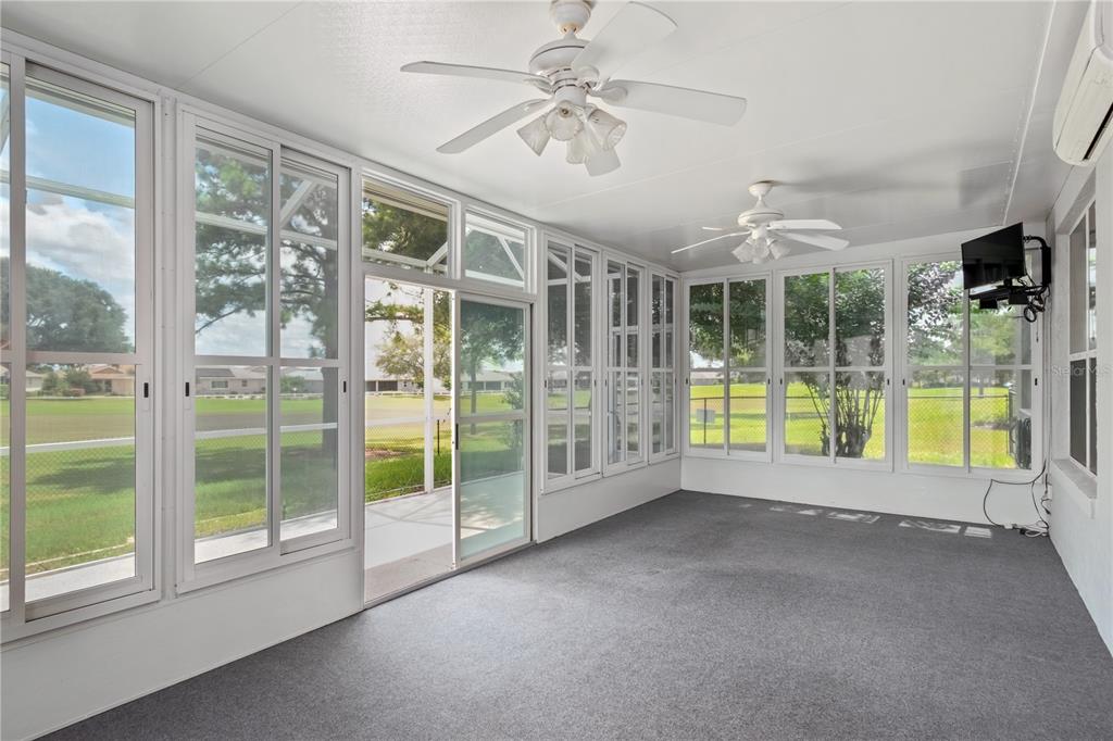 9441 Southwest 90th Street Ocala, FL 34481 - Photo 38 of 48 a view of an empty room with a sliding door
