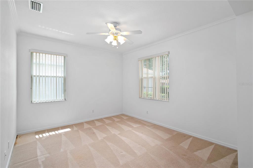 9441 Southwest 90th Street Ocala, FL 34481 - Photo 7 of 48 a view of an empty room with a window