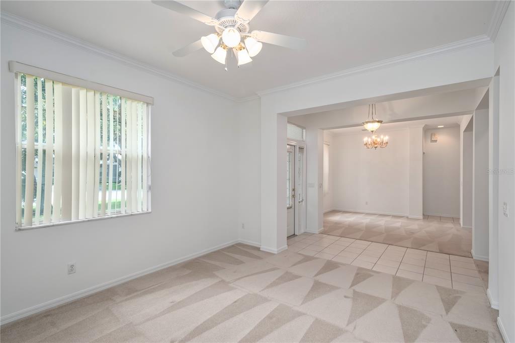 9441 Southwest 90th Street Ocala, FL 34481 - Photo 8 of 48 a view of an empty room with a window