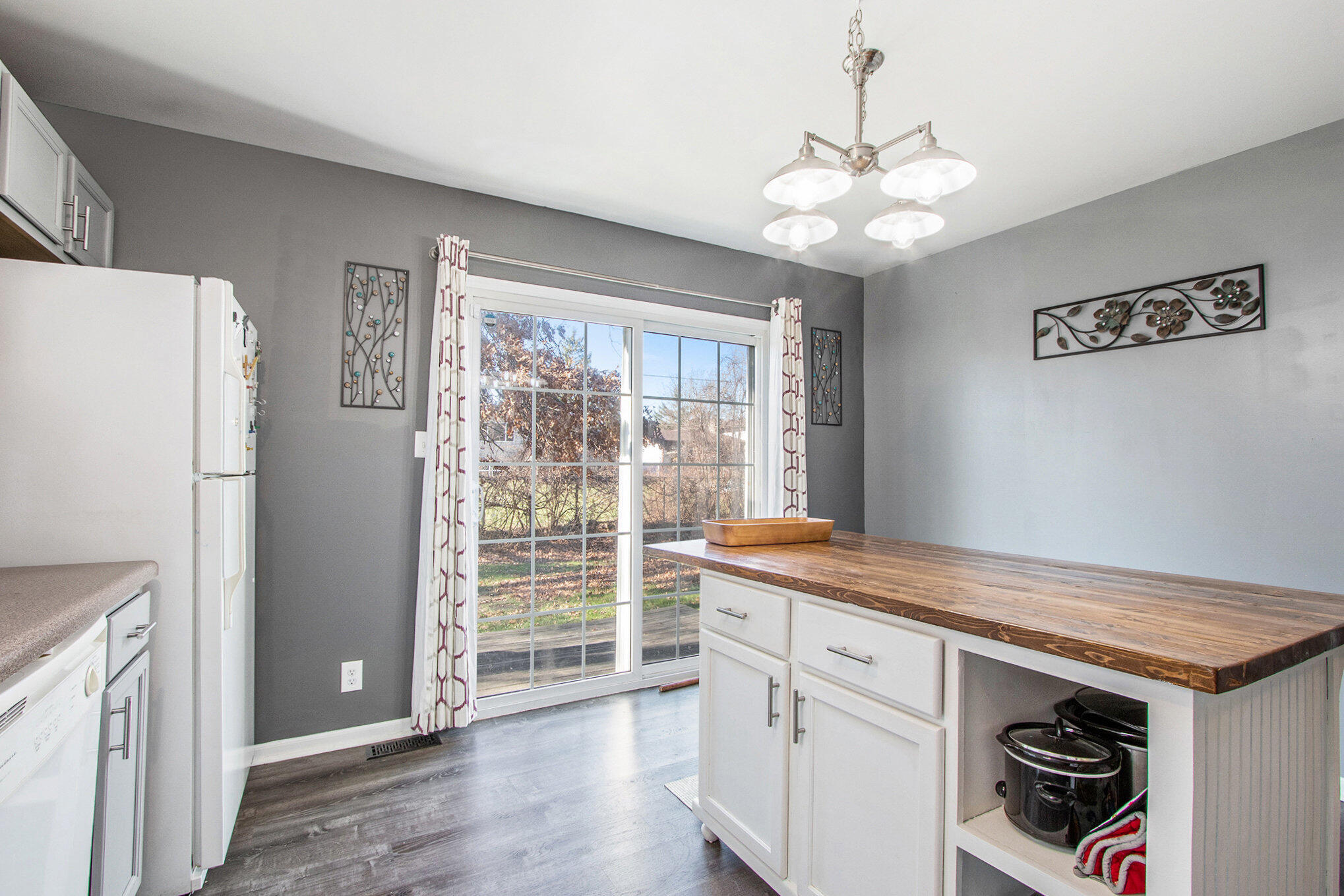 682 Dearborn Road, Unit A Valparaiso, IN 46385 - Photo 9 of 23 a kitchen with a refrigerator and a sink