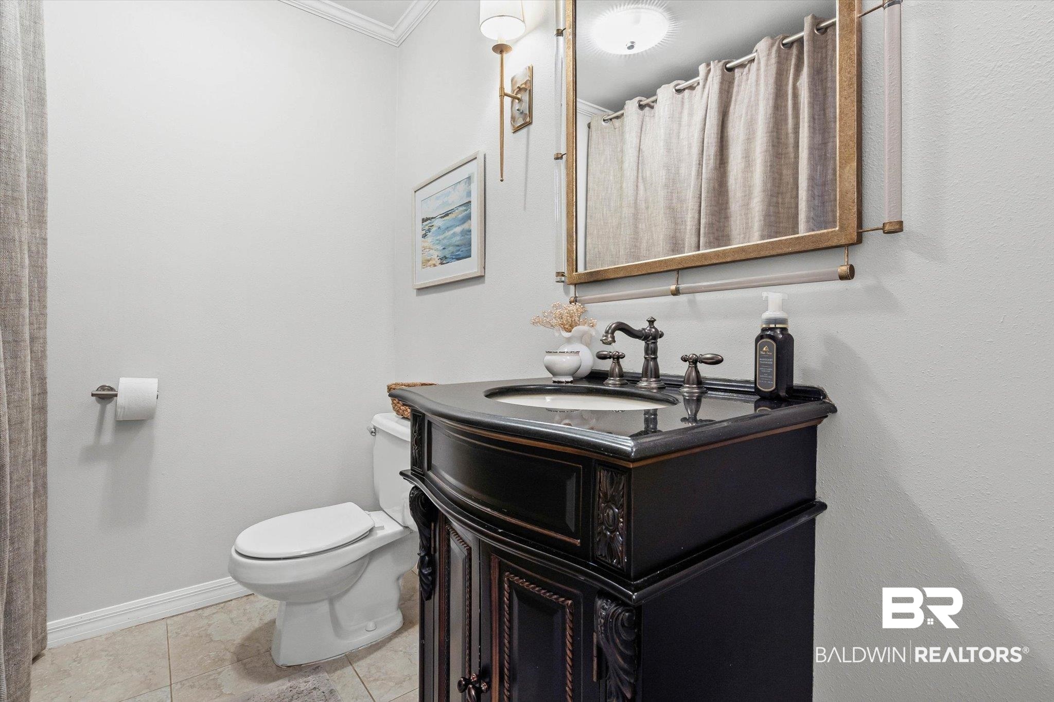 313 Brawood Drive Mobile, AL 36608 - Photo 23 of 32 Full bath with vanity, ornamental molding, light tile patterned flooring, and curtained shower