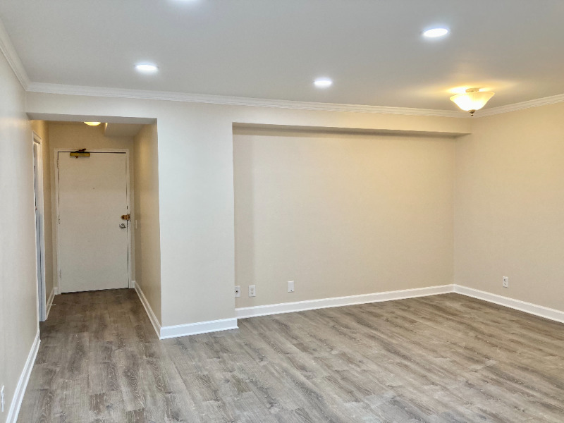 6118 North Sheridan Road, Unit 305 Chicago, IL 60660 - Photo 3 of 5 wooden floor in an empty room with a window