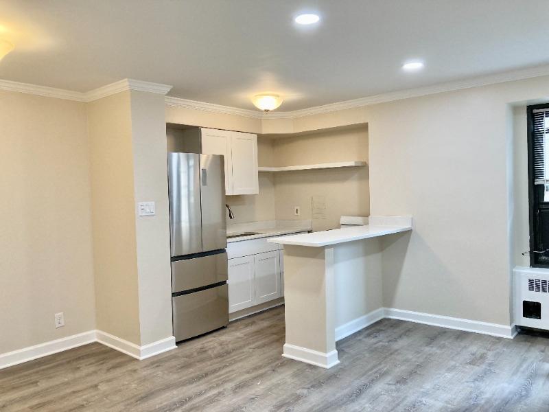 6118 North Sheridan Road, Unit 305 Chicago, IL 60660 - Photo 4 of 5 a kitchen with a refrigerator and a sink