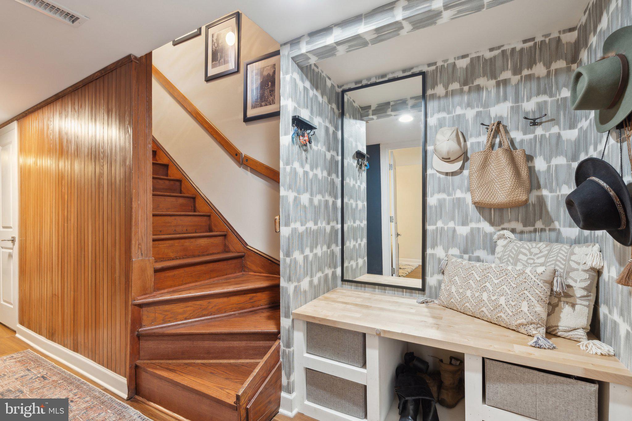 11599 Maple Ridge Road Reston, VA 20190 - Photo 7 of 38 a view of a hallway with wooden floor and entryway