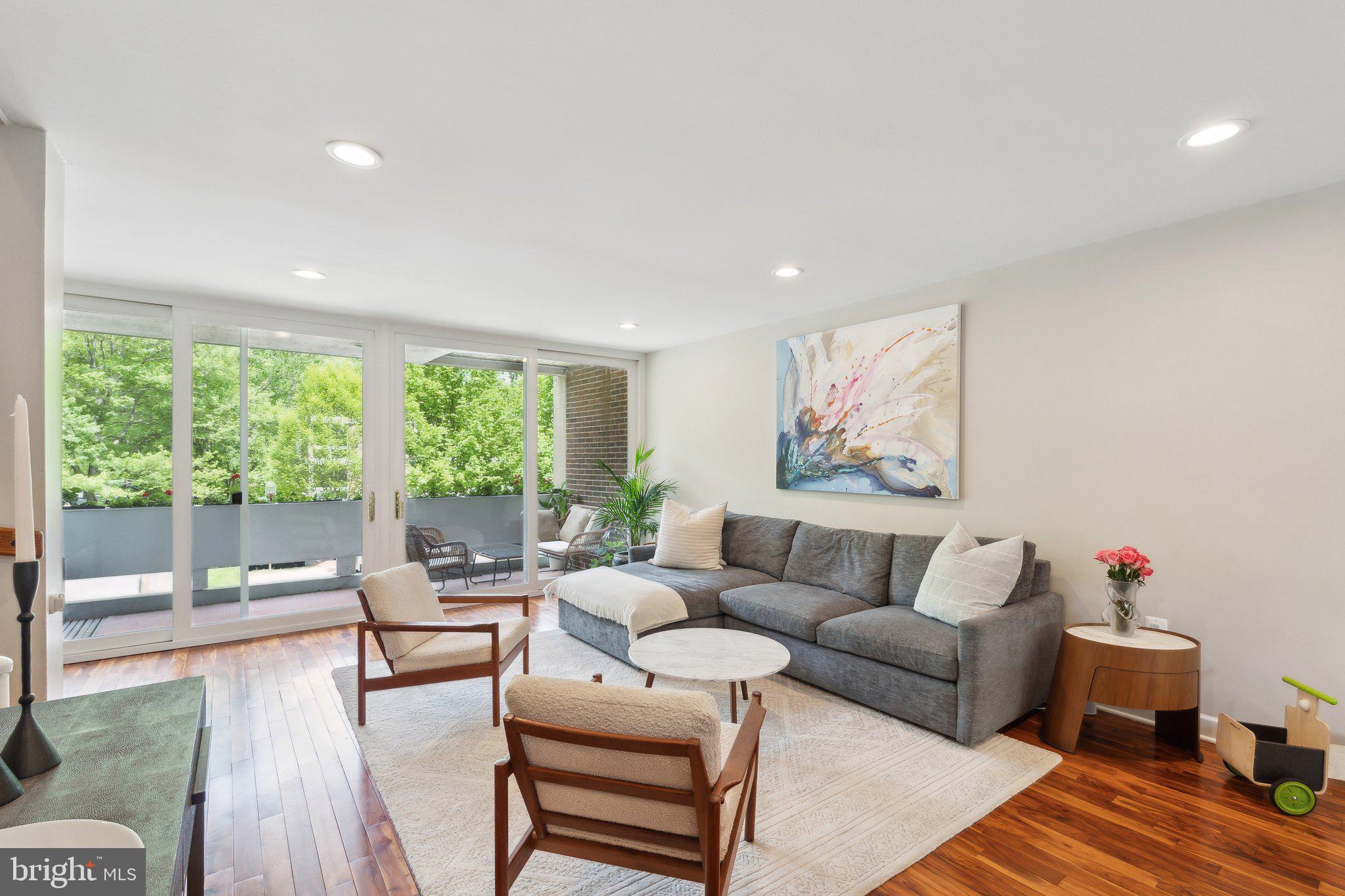 11599 Maple Ridge Road Reston, VA 20190 - Photo 8 of 38 a living room with furniture and a large window