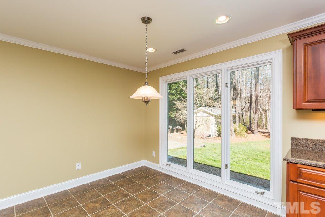 3120 Mt Vernon Church Road Raleigh, NC 27613 - Photo 2 of 9 a view of an empty room with glass door