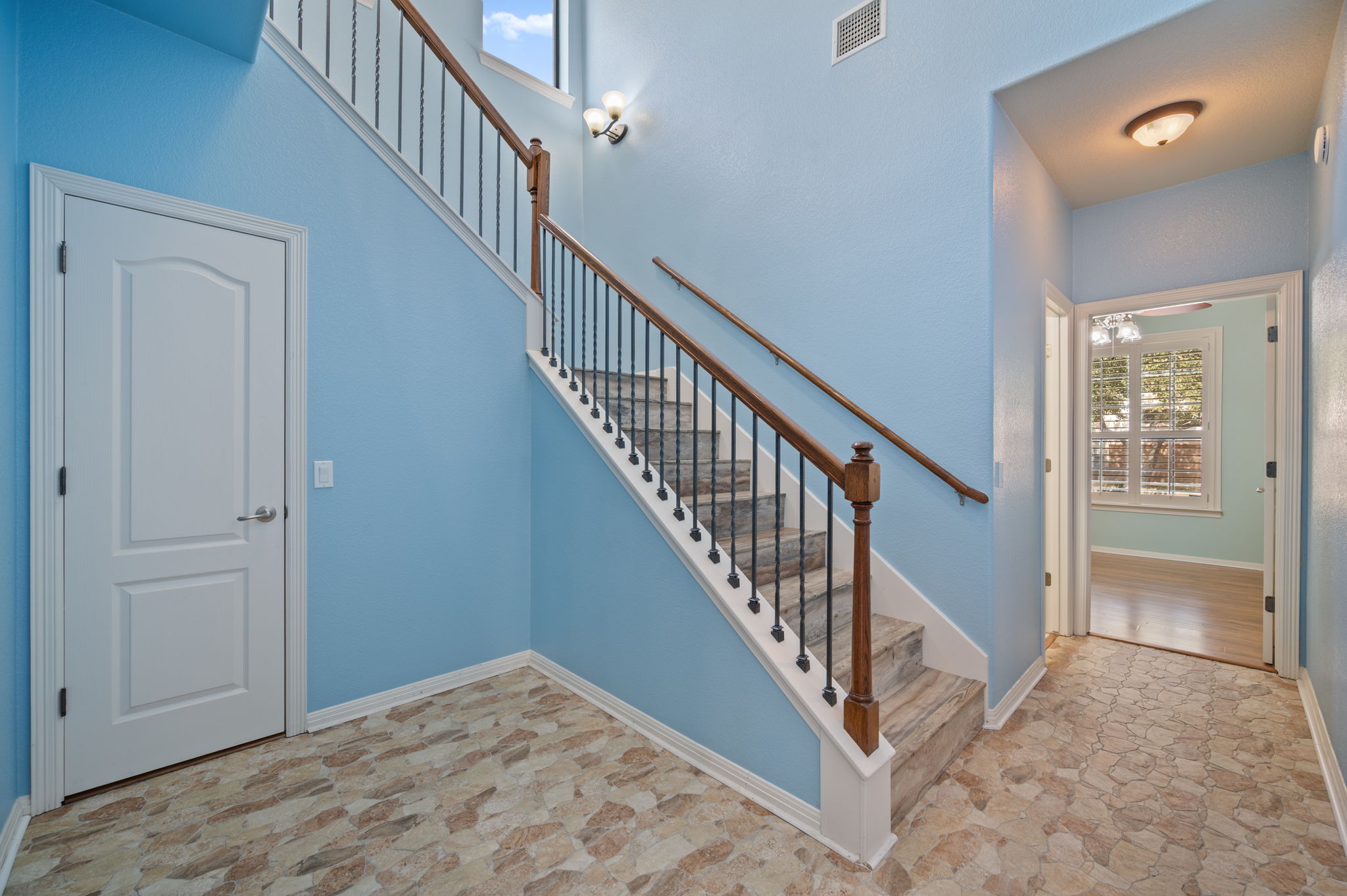 4229 John's Light Drive Austin, TX 78727 - Photo 16 of 27 a view of a hallway with staircase