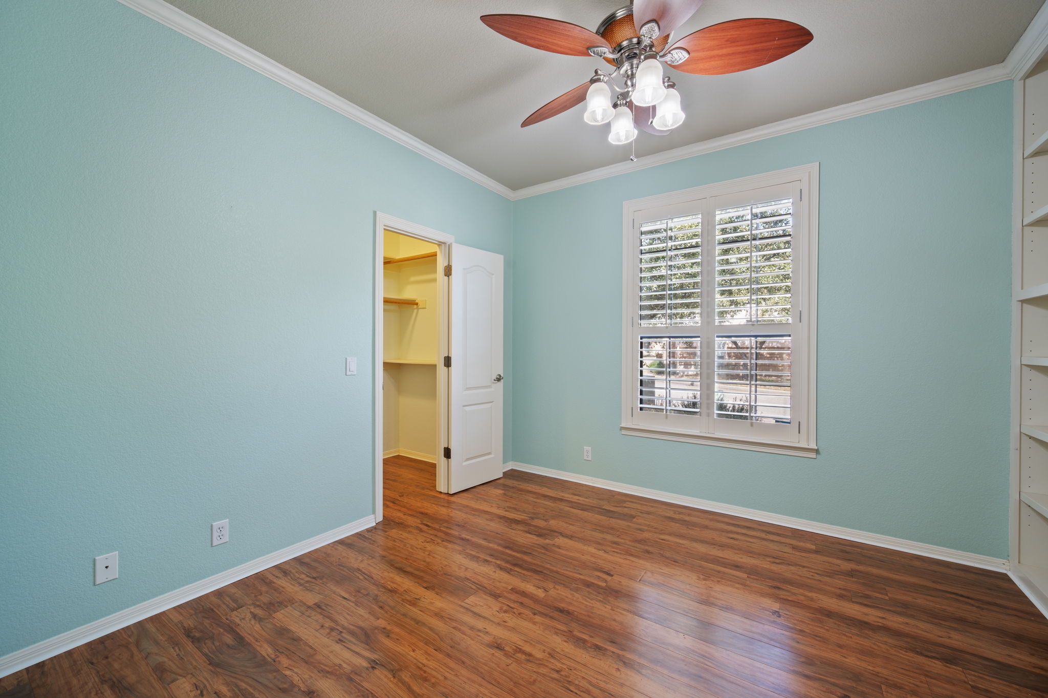 4229 John's Light Drive Austin, TX 78727 - Photo 17 of 27 a view of an empty room with wooden floor and a window