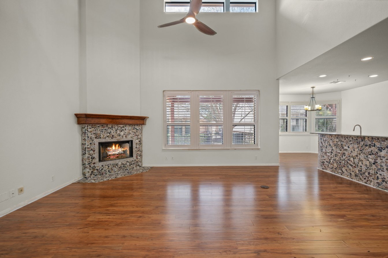 4229 John's Light Drive Austin, TX 78727 - Photo 2 of 27 a view of an empty room with glass door and wooden floor