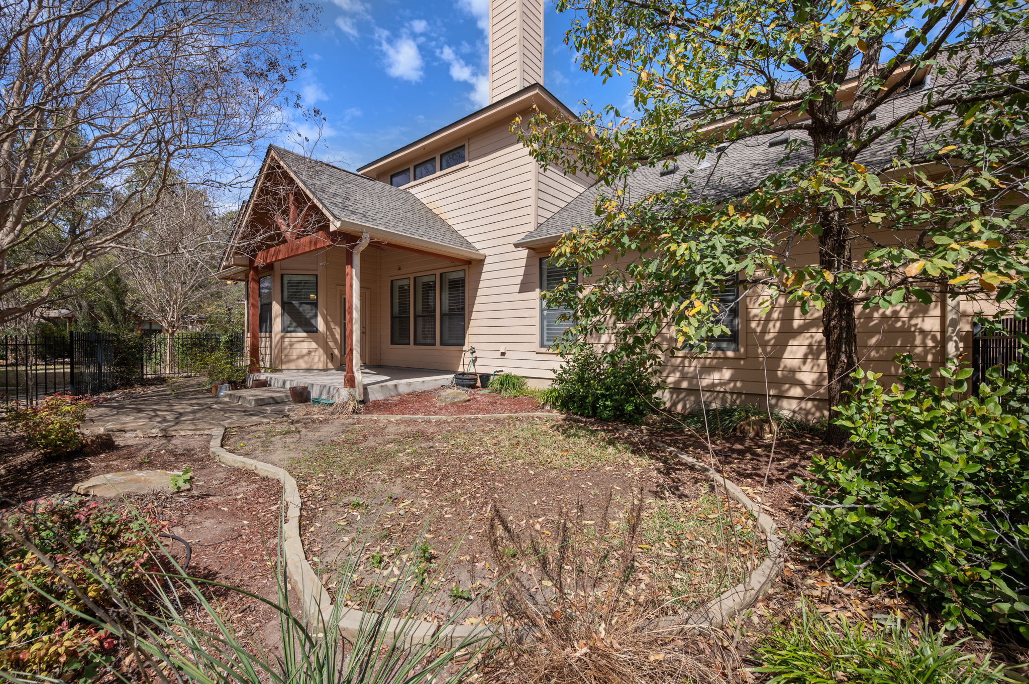 4229 John's Light Drive Austin, TX 78727 - Photo 25 of 27 a view of a house with a yard and large tree