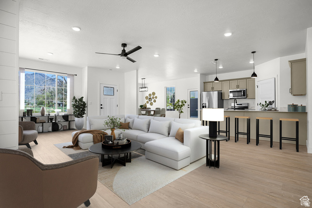 1631 West Century Lane, Unit C Mapleton, UT 84664 - Photo 1 of 31 Open-concept living space featuring wood-finish flooring, recessed lighting, and a contemporary ceiling fan