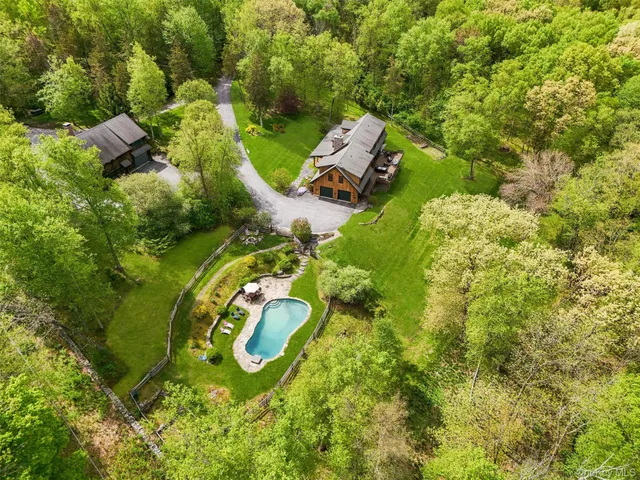 an aerial view of a house with a garden