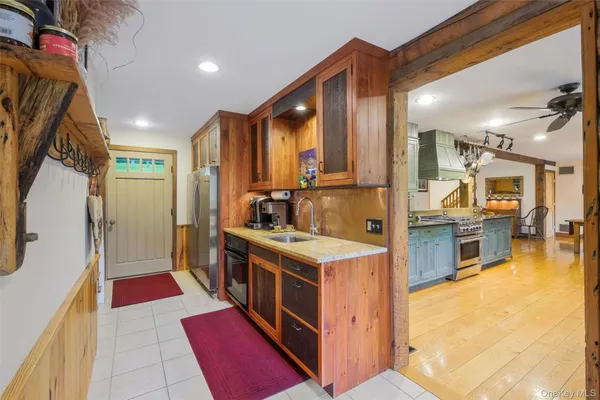 a kitchen with stainless steel appliances granite countertop a stove and a refrigerator