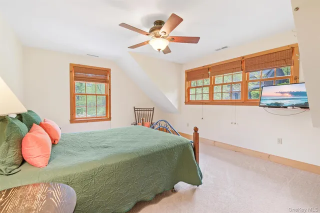 a bedroom with a bed and dresser