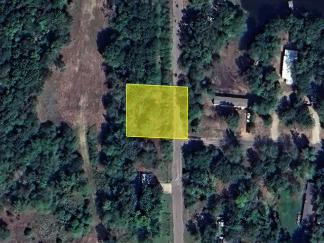 an aerial view of a house with a garden and swimming pool