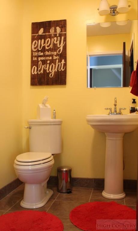 115 Martys Road Boone, NC 28607 - Photo 12 of 43 a bathroom with a toilet sink and mirror