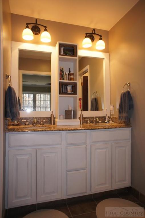 115 Martys Road Boone, NC 28607 - Photo 16 of 43 a bathroom with a sink and a mirror