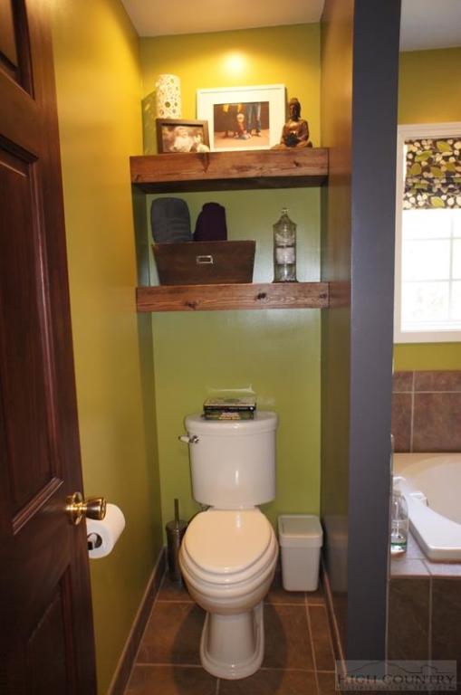 115 Martys Road Boone, NC 28607 - Photo 18 of 43 a bathroom with a toilet and a sink