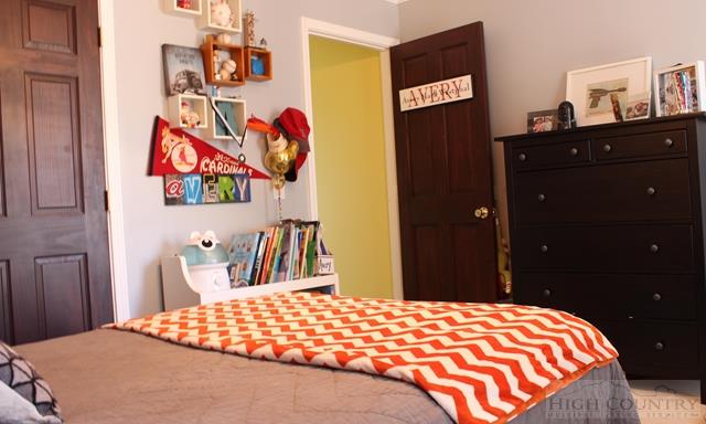 115 Martys Road Boone, NC 28607 - Photo 23 of 43 a bedroom with a bed and dresser