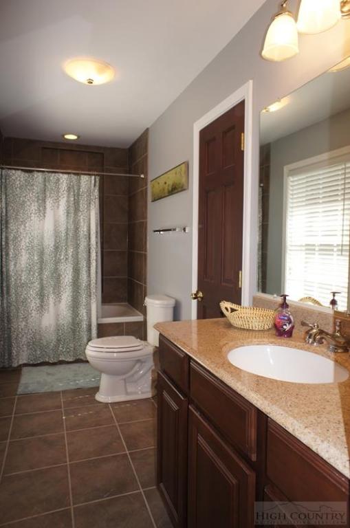 115 Martys Road Boone, NC 28607 - Photo 25 of 43 a bathroom with a sink a toilet and shower