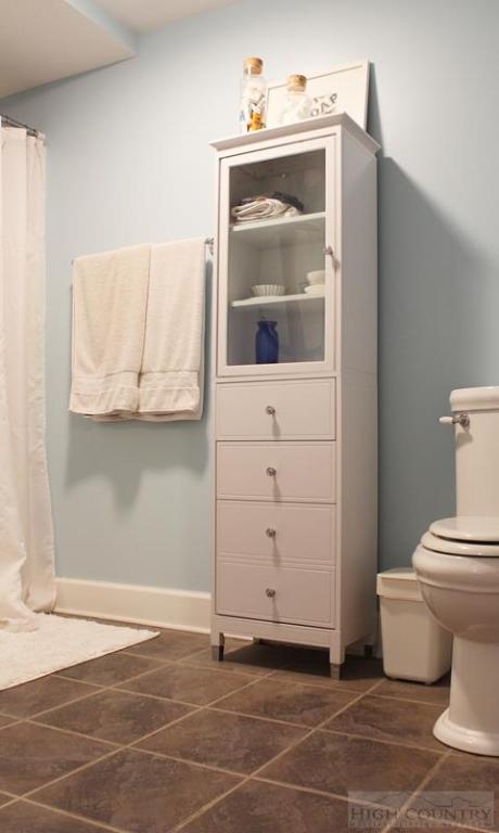 115 Martys Road Boone, NC 28607 - Photo 28 of 43 a bathroom with a toilet and a mirror