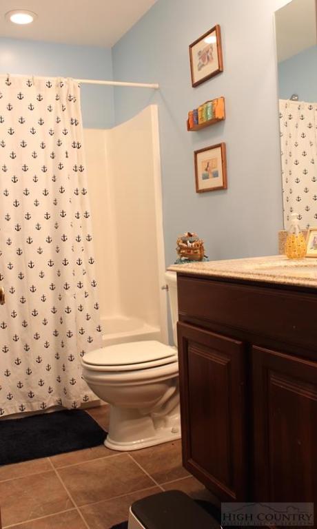 115 Martys Road Boone, NC 28607 - Photo 30 of 43 a bathroom with a sink toilet and shower