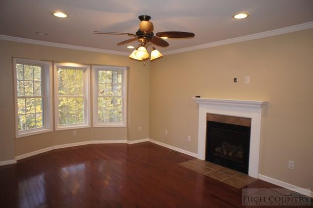 115 Martys Road Boone, NC 28607 - Photo 9 of 43 a view of an empty room with a fireplace and a window