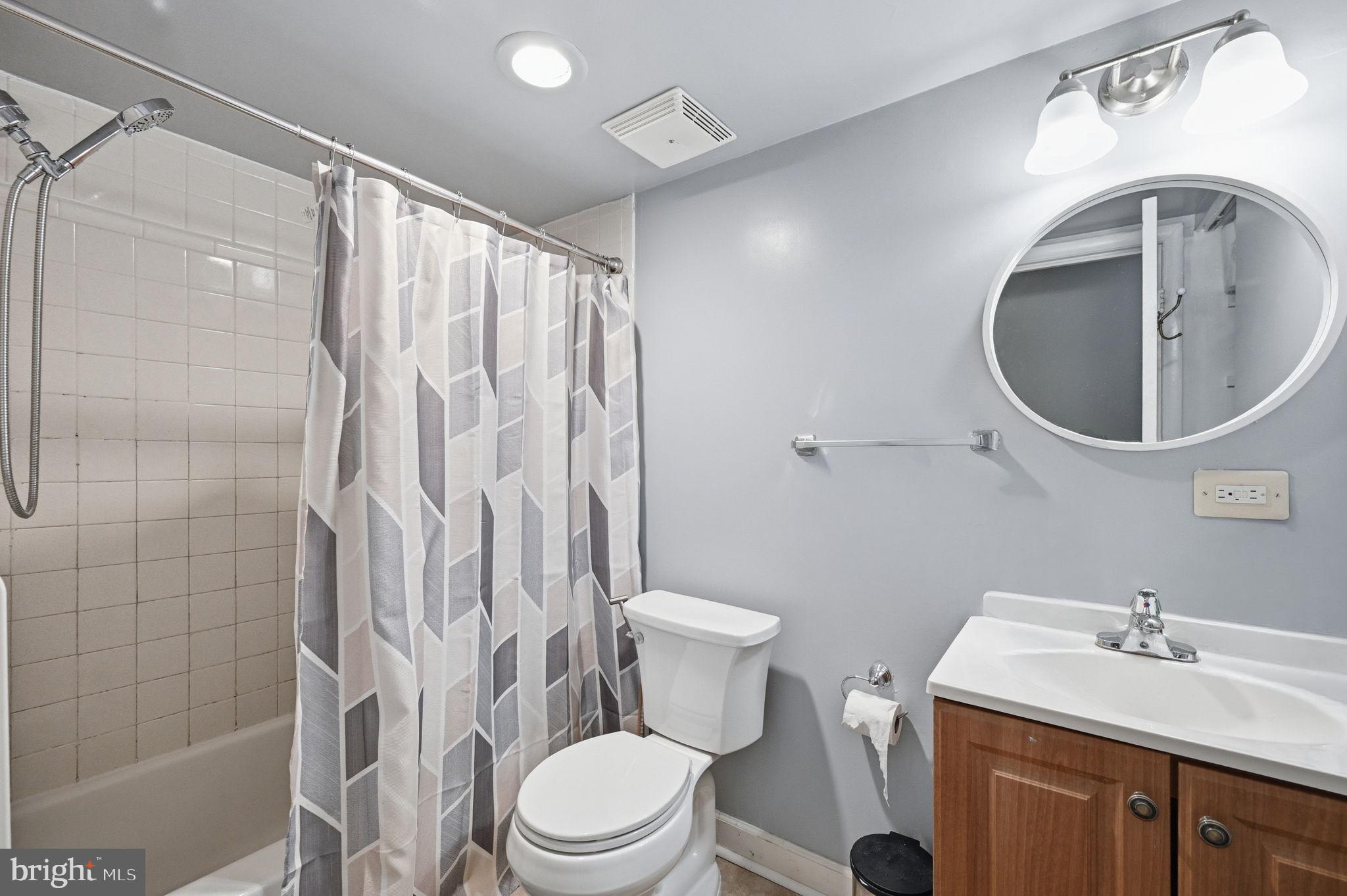 3366 Woodburn Road, Unit 23 Annandale, VA 22003 - Photo 8 of 16 a bathroom with a sink toilet and shower