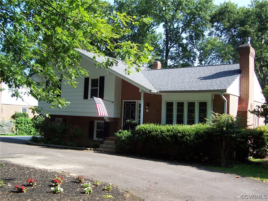 8410 Gaylord Road Henrico, VA 23229 - Photo 17 of 17 a front view of a house with a yard