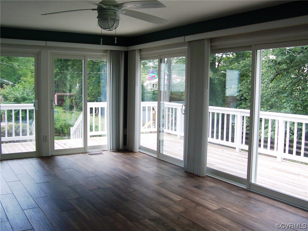 8410 Gaylord Road Henrico, VA 23229 - Photo 3 of 17 a view of a porch with wooden floor and outer view