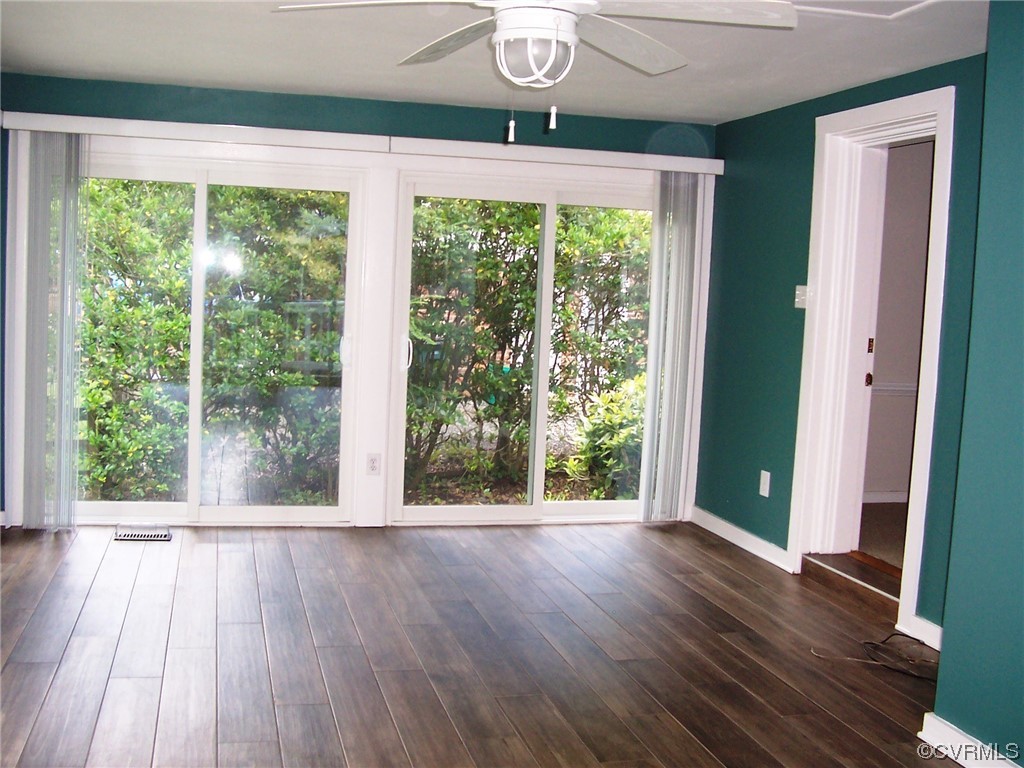 8410 Gaylord Road Henrico, VA 23229 - Photo 5 of 17 a view of a room with wooden floor and large windows