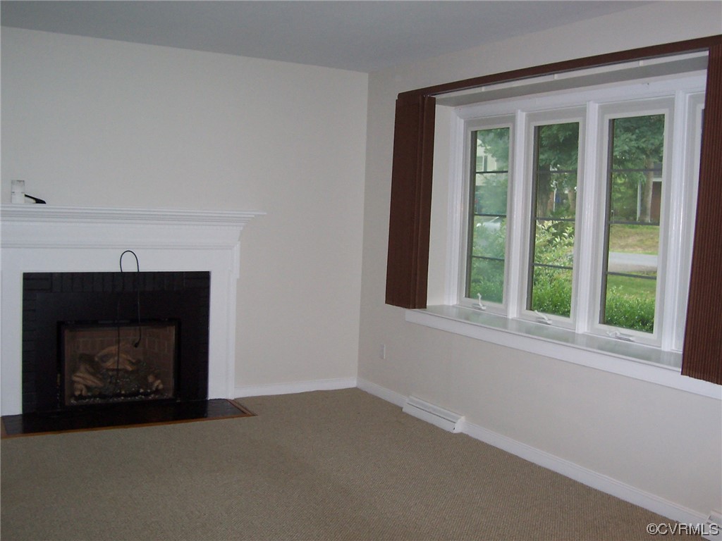 8410 Gaylord Road Henrico, VA 23229 - Photo 7 of 17 a view of an empty room with a fireplace