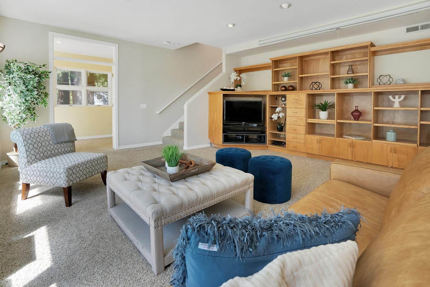 23342 Deerfield Road Los Gatos, CA 95033 - Photo 15 of 36 a living room with furniture fireplace and a flat screen tv