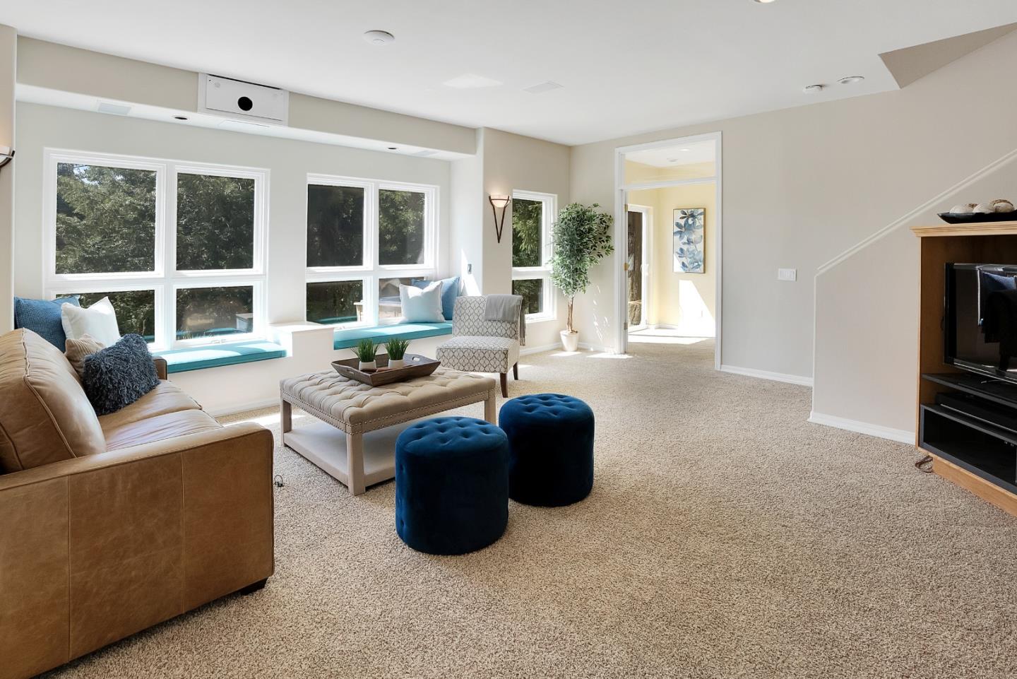 23342 Deerfield Road Los Gatos, CA 95033 - Photo 16 of 36 a living room with couches and a large window with kitchen view
