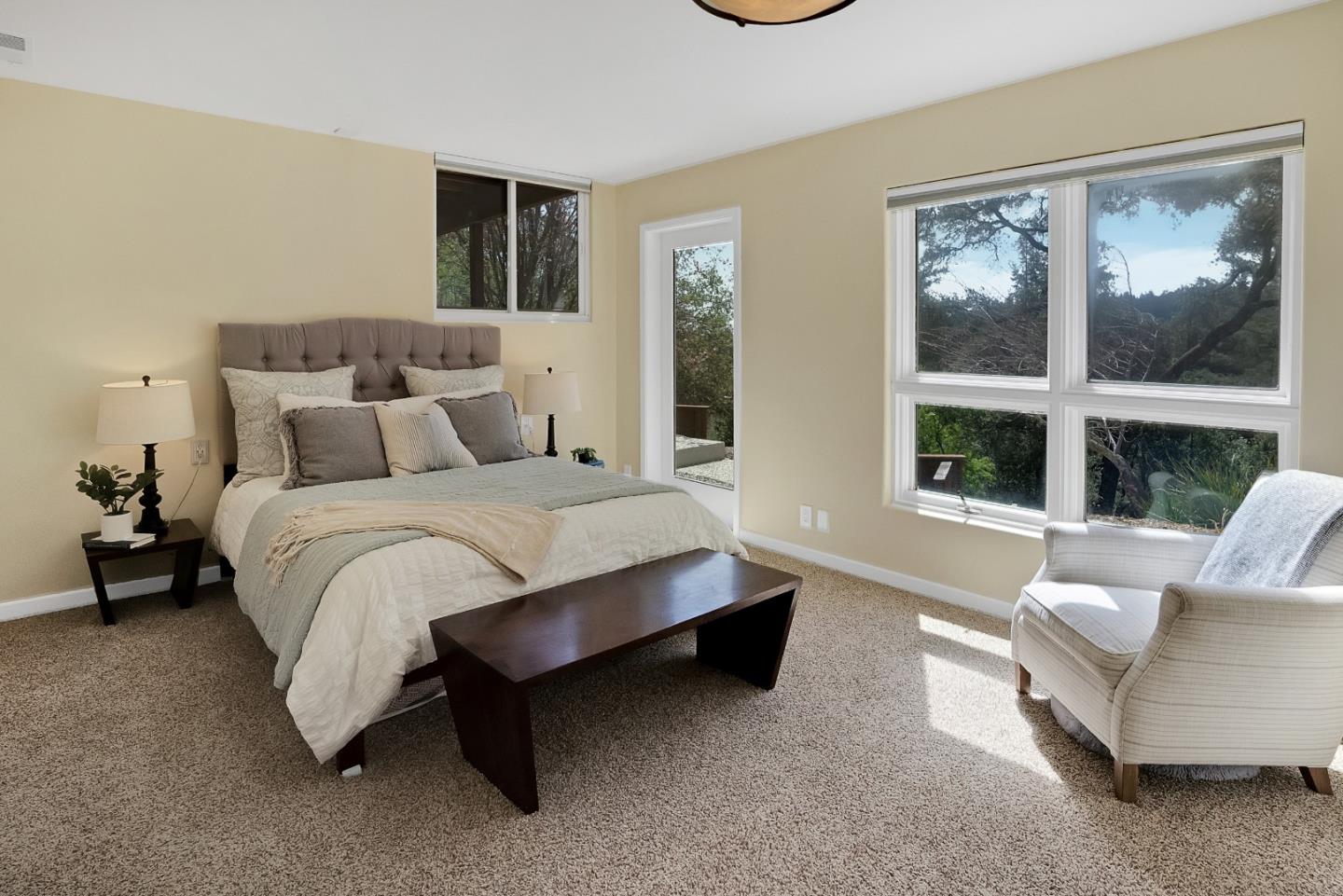 23342 Deerfield Road Los Gatos, CA 95033 - Photo 20 of 36 a spacious bedroom with a bed and a large window