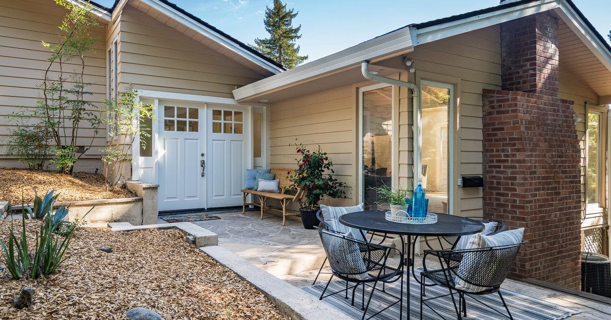 23342 Deerfield Road Los Gatos, CA 95033 - Photo 2 of 36 a view of a patio with table and chairs and potted plants