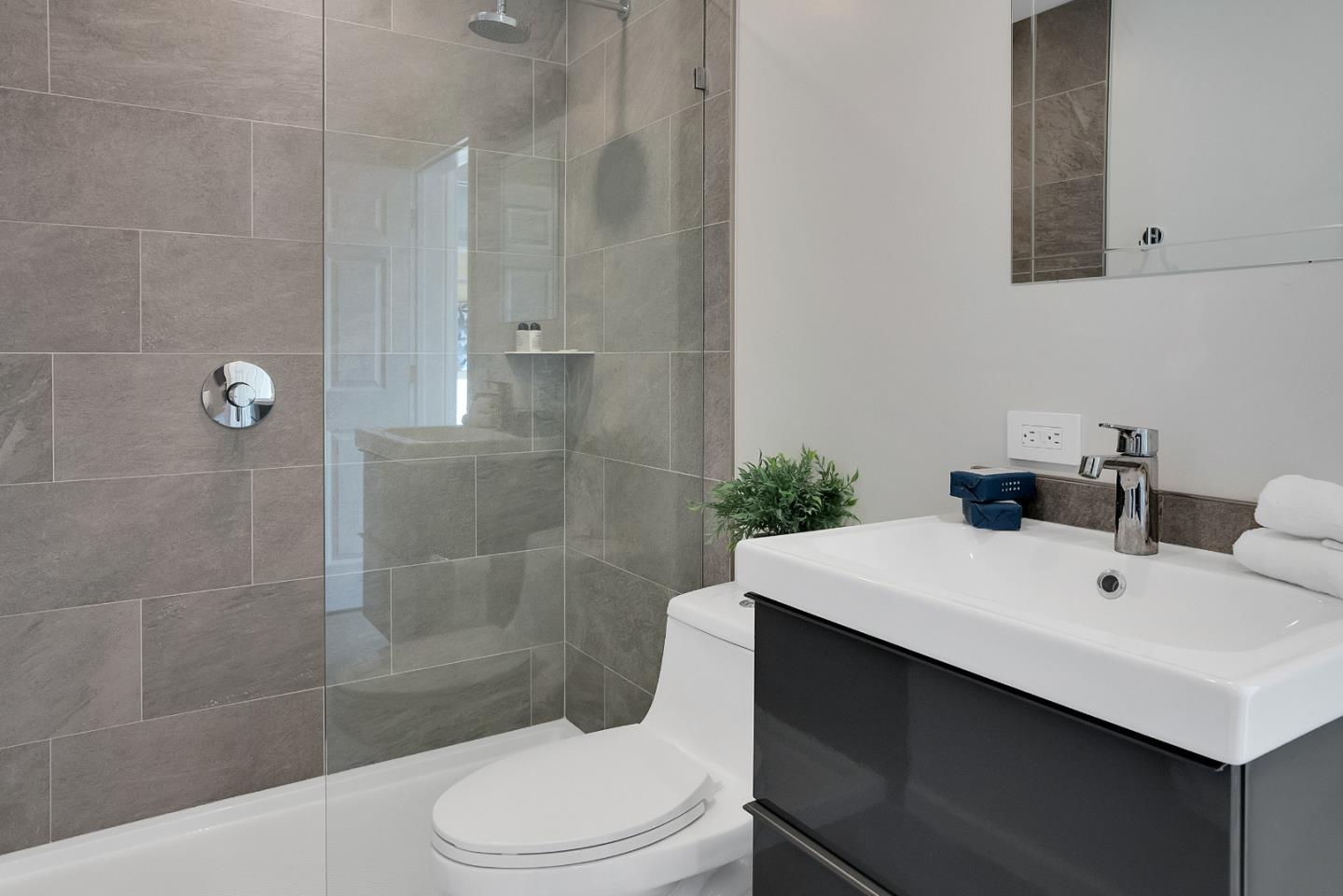 23342 Deerfield Road Los Gatos, CA 95033 - Photo 21 of 36 a bathroom with a sink a toilet and shower