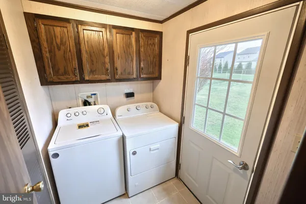 a bedroom with furniture and windows
