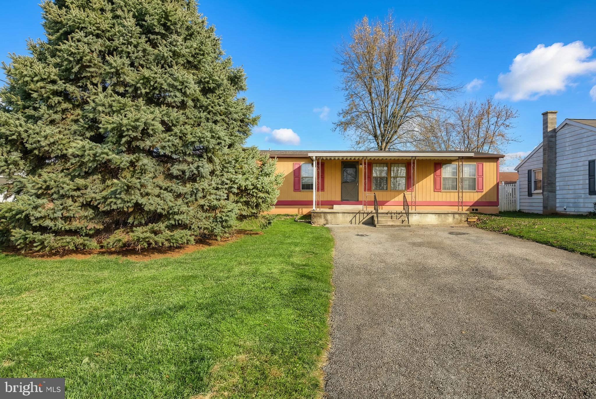 2818 Oakland Road Dover, PA 17315 - Photo 2 of 32 a view of a backyard with plants and patio