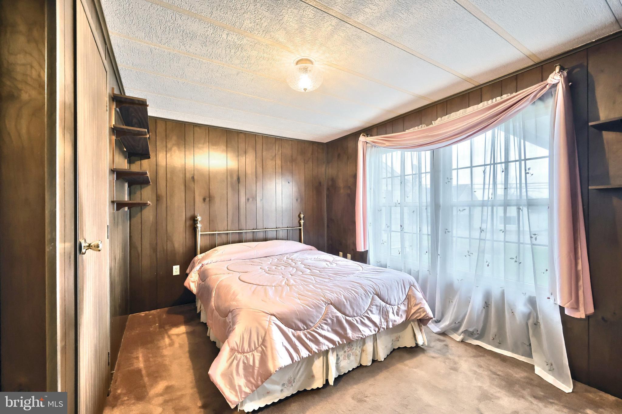 2818 Oakland Road Dover, PA 17315 - Photo 20 of 32 a bedroom with a bed and a large window