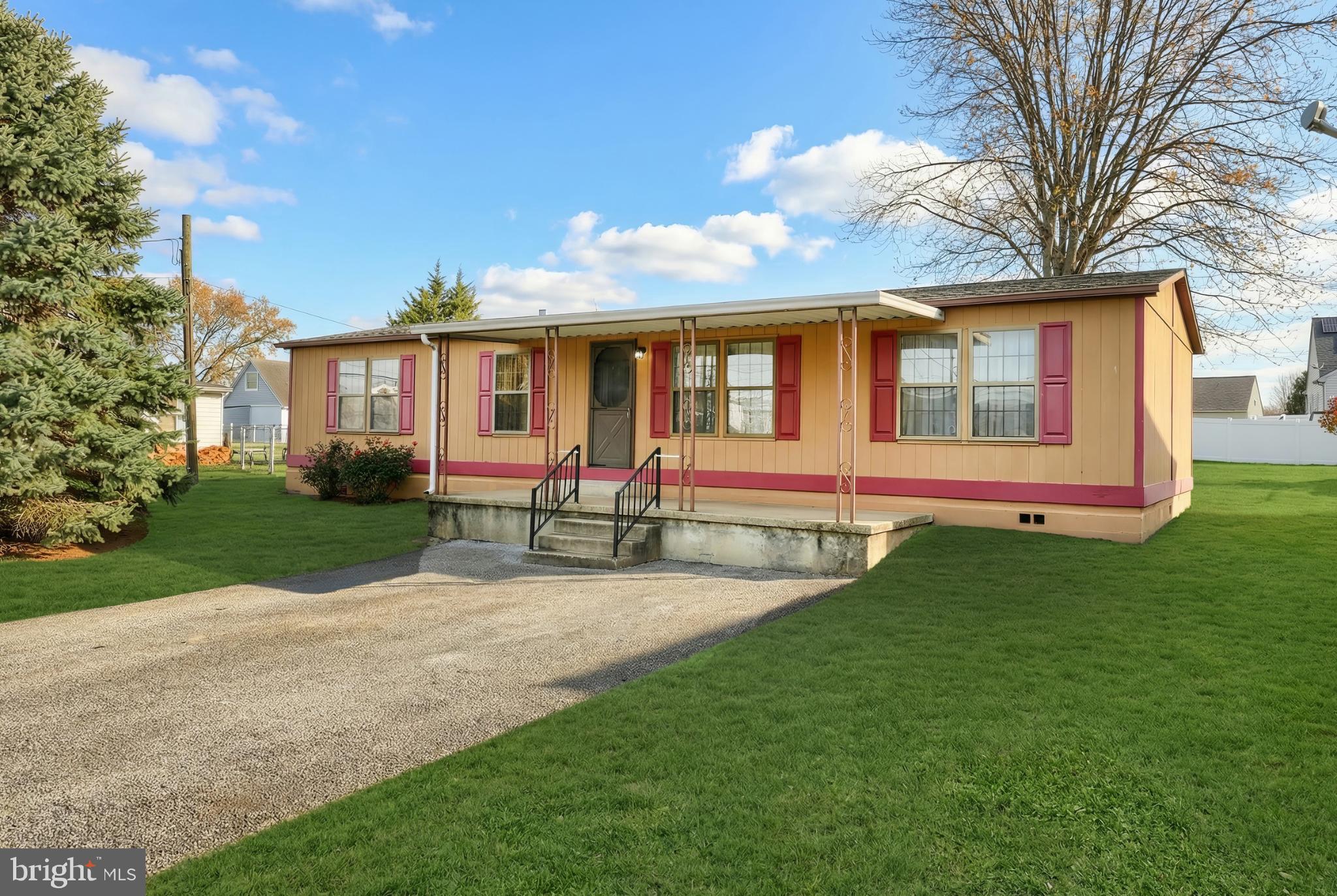 2818 Oakland Road Dover, PA 17315 - Photo 31 of 32 a front view of a house with garden
