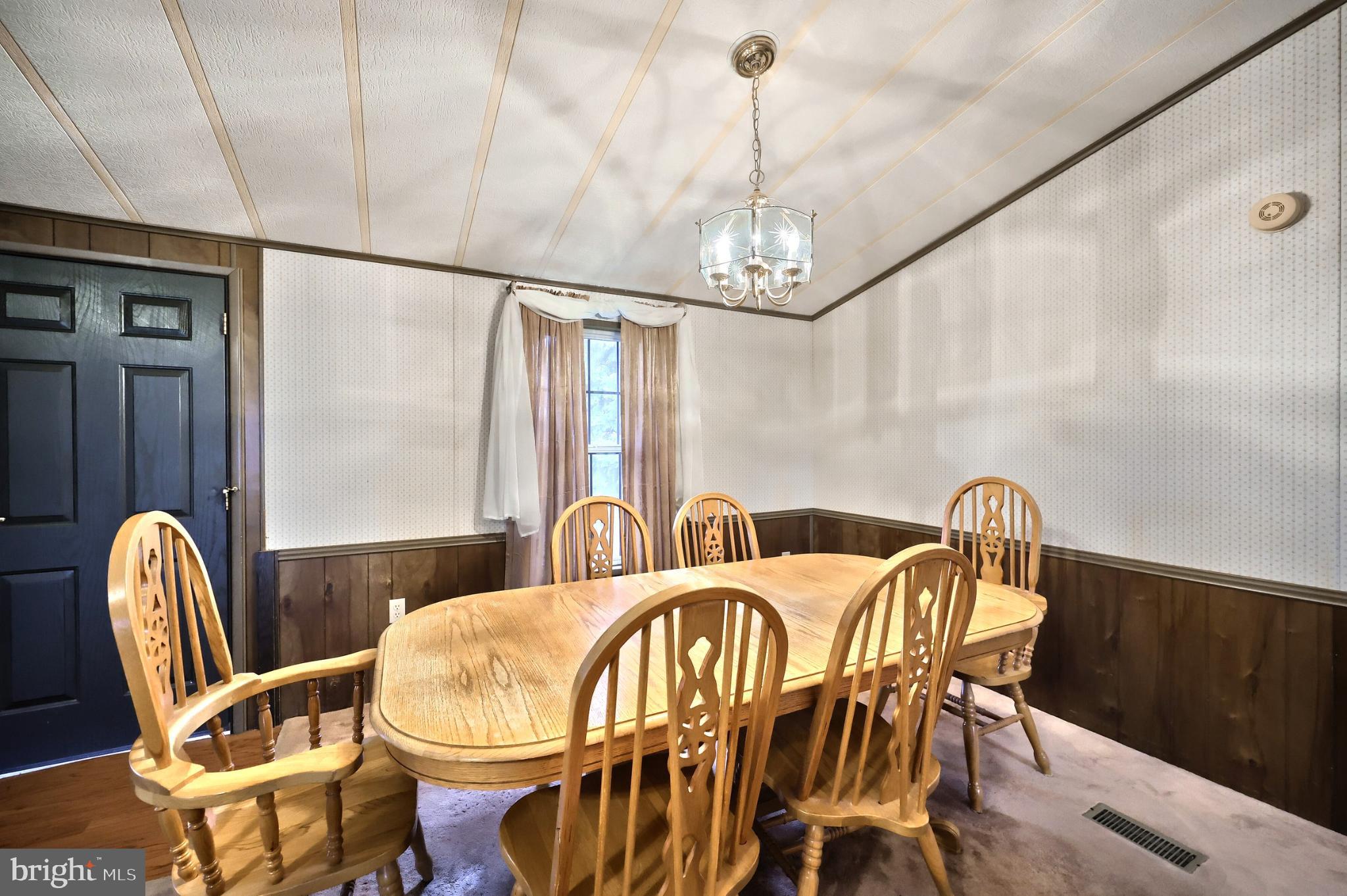 2818 Oakland Road Dover, PA 17315 - Photo 8 of 32 a view of a dining room with furniture wooden floor and chandelier