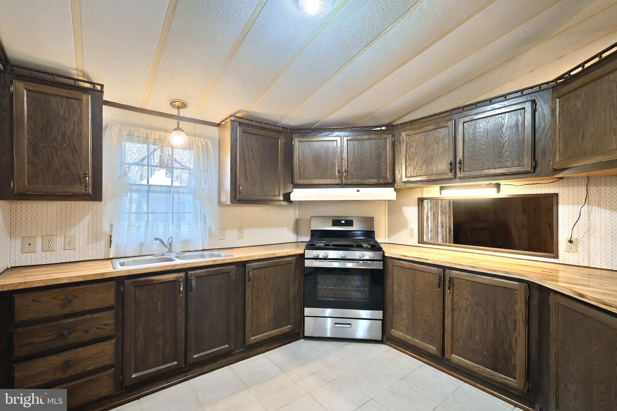 2818 Oakland Road Dover, PA 17315 - Photo 9 of 32 a kitchen with stainless steel appliances wooden cabinets and a sink